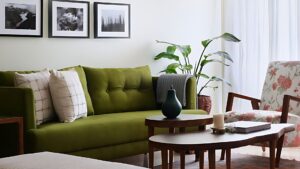 Custom wooden furniture including sofa table, chair, centre table, and stool in a modern living room.