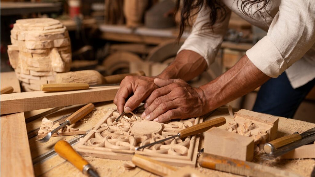 Artisans working in a wooden furniture workshop creating handcrafted pieces with skill and precision