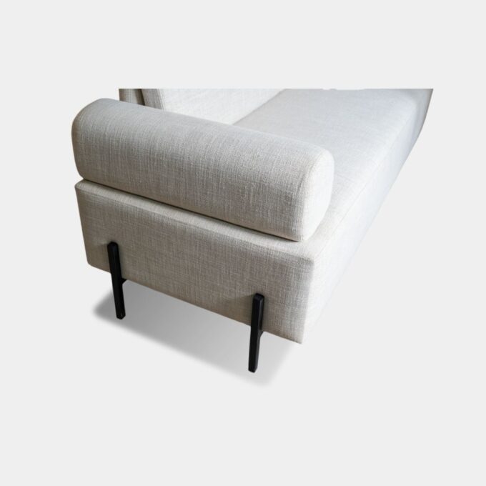 The Simplified Two Seater Sofa is designed with comfort as the main focus and features a single-sided arm support for a relaxed seating experience. Built on a solid teak wood frame, it uses a combination of high-quality foams, including 40-density and memory foam, for enhanced support and softness. Measuring 4.5 feet in length and 28 inches in depth, it offers a seating height of 18 inches and a total height ranging from 28 to 30 inches. This sofa is ideal for compact spaces without compromising on comfort.